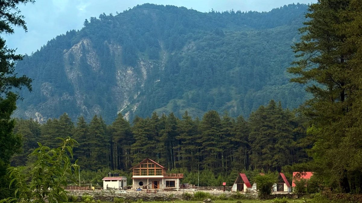 The resort below the forested mountain