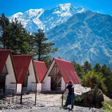Cottages beneath a snow-capped peak